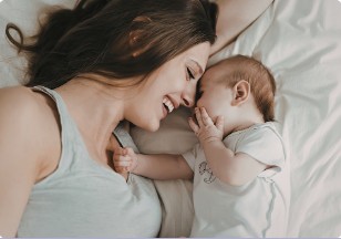Parent smiling at a baby